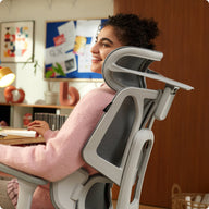a man sitting in a gray HBADA E3 AIR ergonomic gaming chair playing VR ~scene