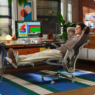 a man sitting in a gray HBADA E3 AIR ergonomic gaming chair playing VR ~scene